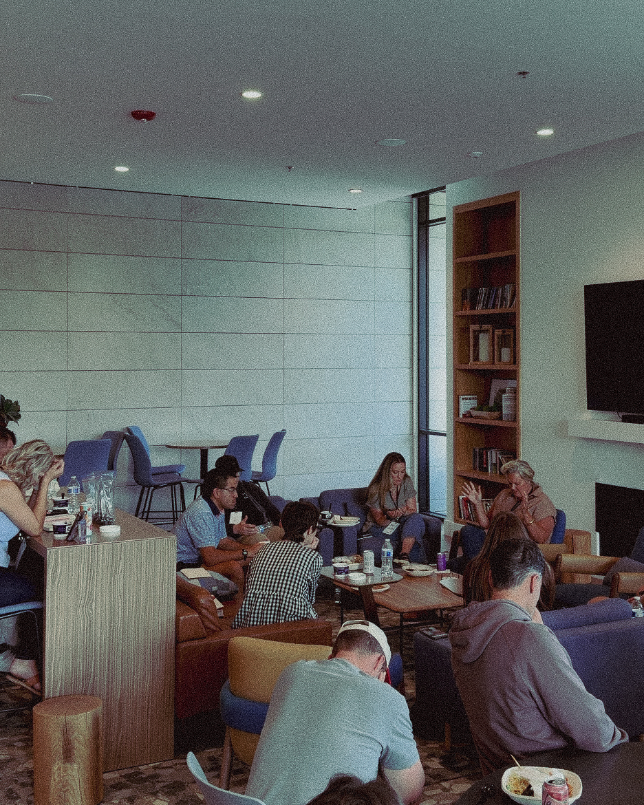 Young leaders gathered in small groups around tables